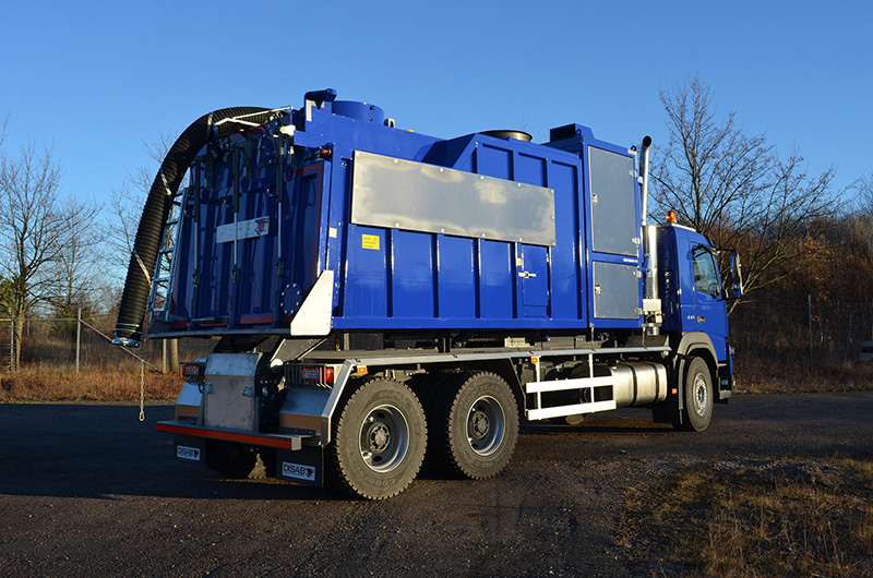 DISAB Centurion™ P14 vacuum truck with a square tank parked in an open area, designed for ergonomic operation, dust collection, and efficient discharge using a truck-powered vacuum system.